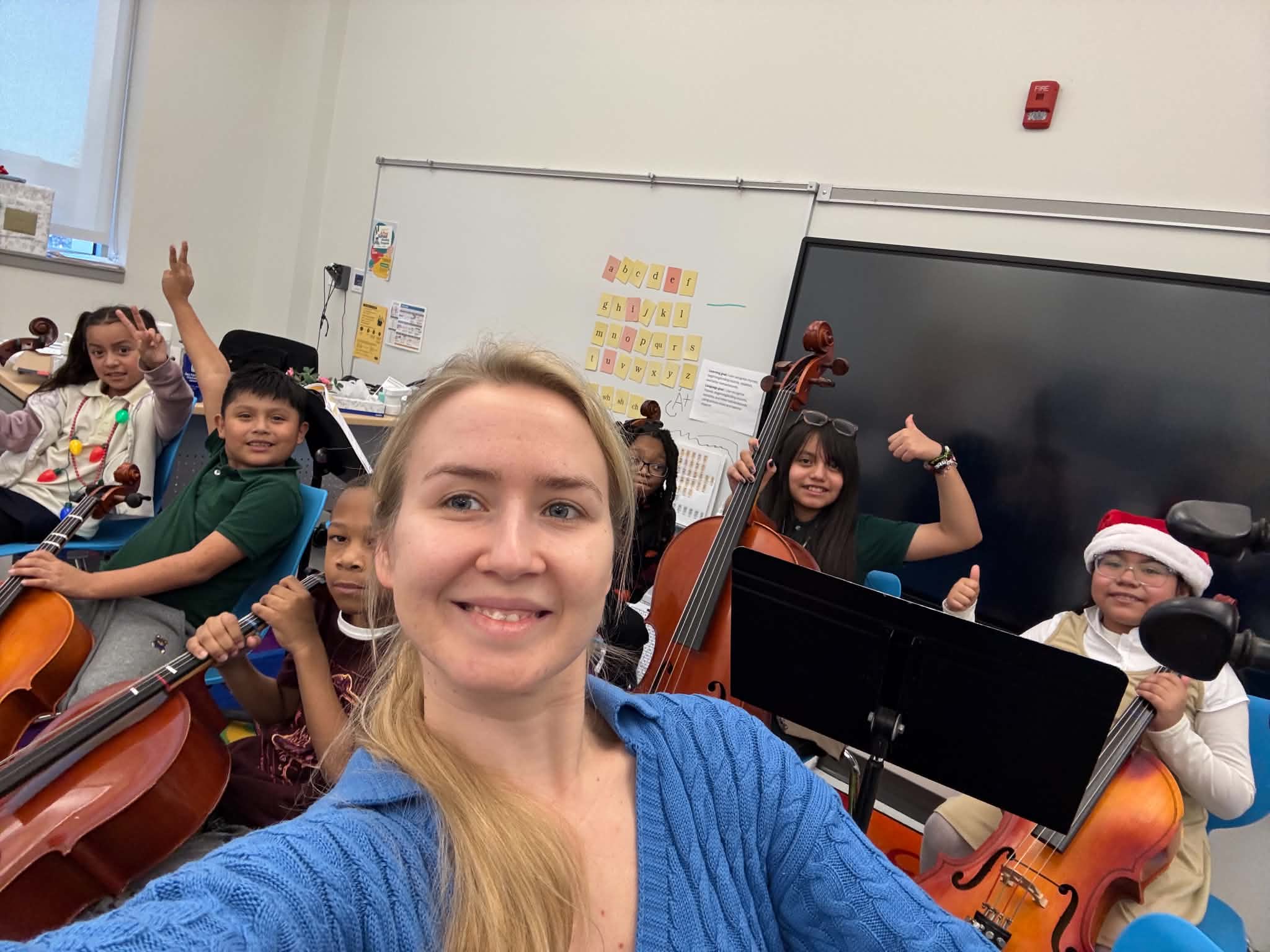 Evanghelina teaching cello posture